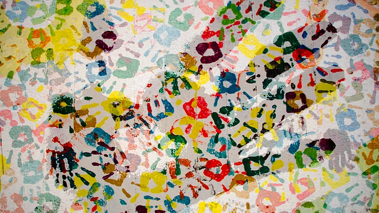 Handprint on a coloured pattern