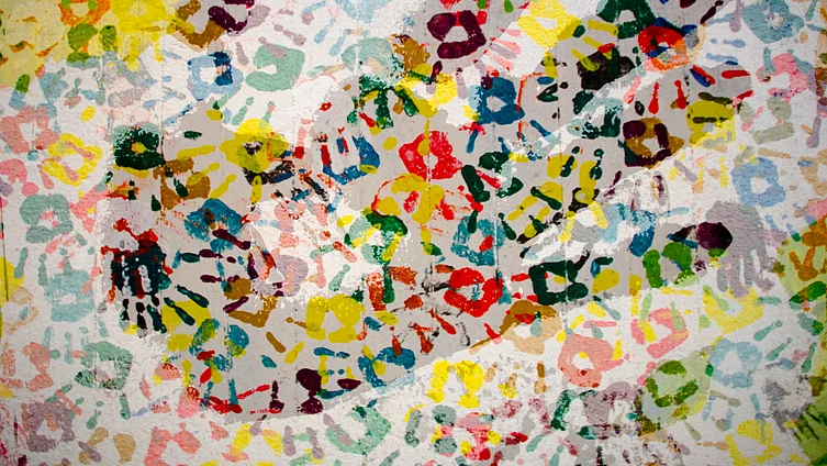 Handprint on a coloured pattern