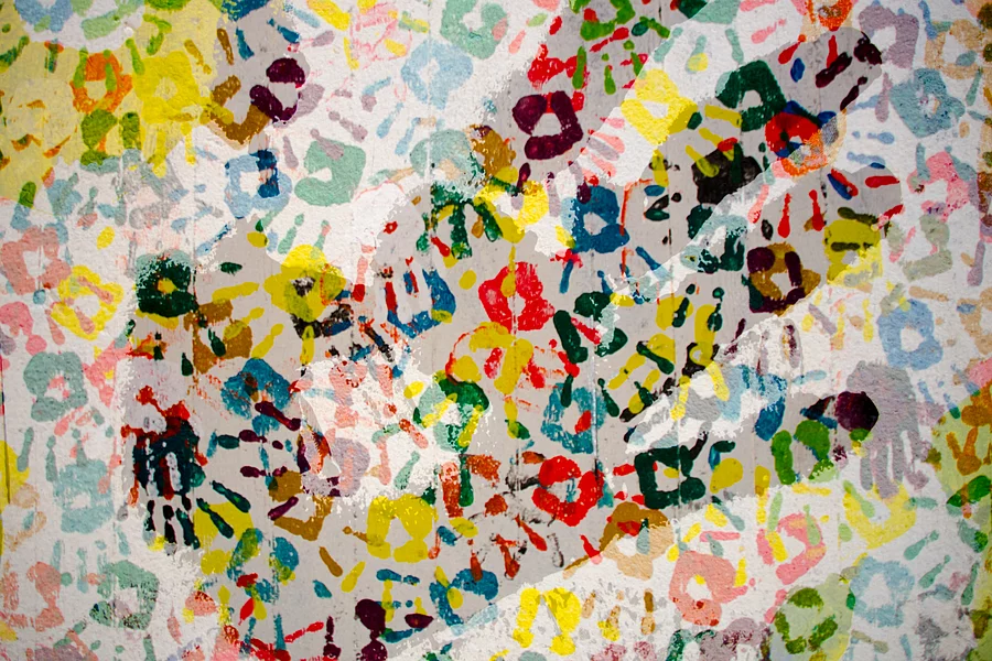 Handprint on a coloured pattern