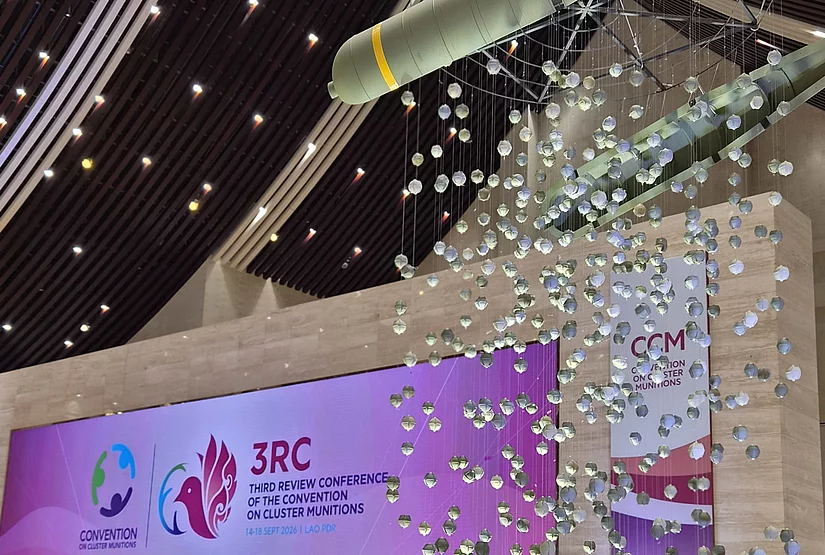 Installation of a bomb casing releasing bomblets above the Third Review Conference stage in Vientiane.